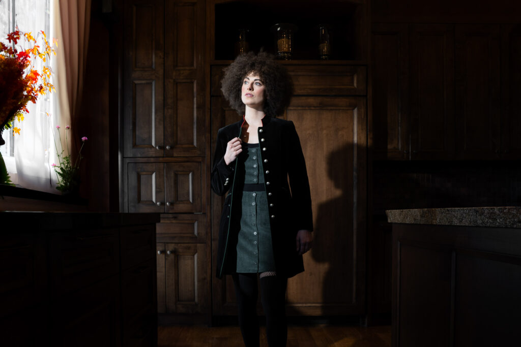 Young women in a very fancy large house wearing the Austrian jacket Selina by Robert W. Stolz